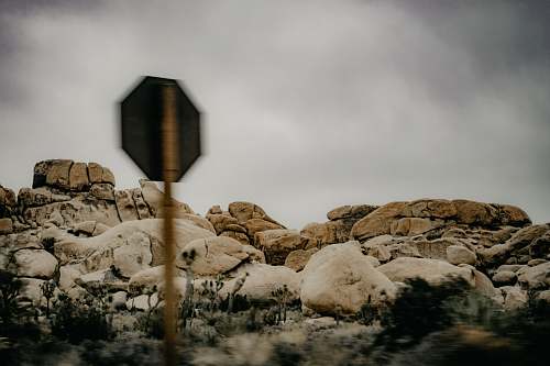 rock signage near rock formation joshua tree
